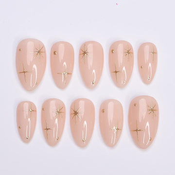 Minimal Press on Nail Gold Starburst with Nude Base | Everyday Fake Nail Art in Short Almond | Handmade Nail Art for Holiday, Birthday, Trip